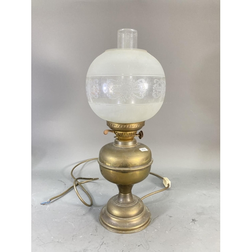 217 - A collection of brassware to include electric converted oil lamp with etched glass shade, Victorian ... 