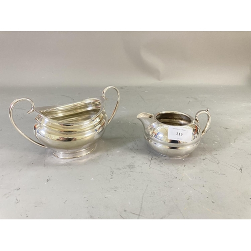 219 - Four pieces of silver plated ware, T.W & S three piece coffee/tea set and Civic milk jug