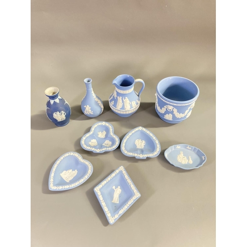 158 - Nine pieces of Wedgwood blue Jasperware to include 19th century bud vase - approx. 12.5cm high, Pete... 