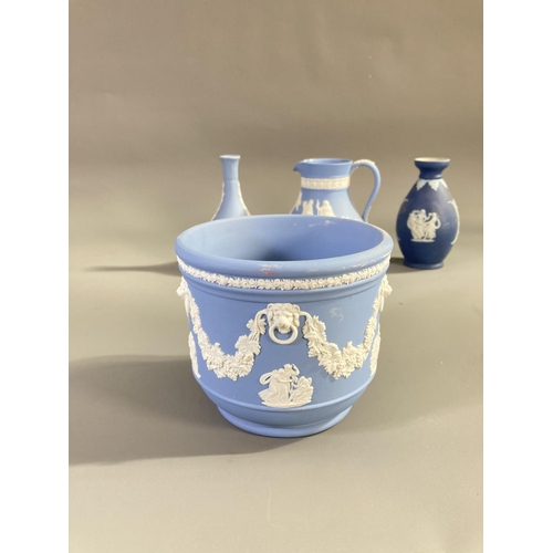 158 - Nine pieces of Wedgwood blue Jasperware to include 19th century bud vase - approx. 12.5cm high, Pete... 
