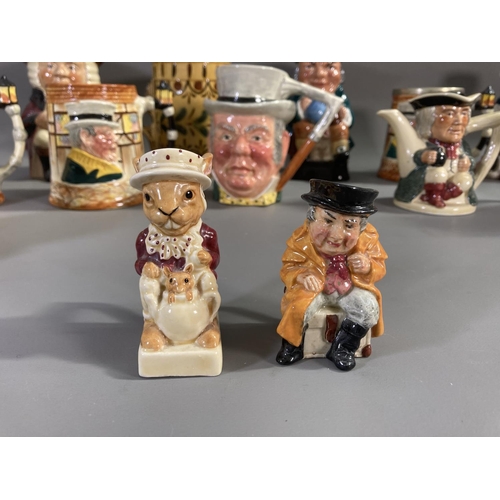 161 - A collection of ceramic Toby and character jugs to include Sandland Sairey Gamp and Weller jug with ... 
