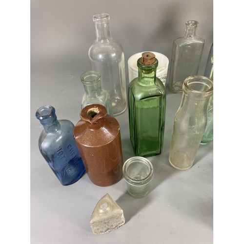 176 - A collection of vintage ceramics and glassware to include apothecary bottles, stoneware bottle, Jame... 