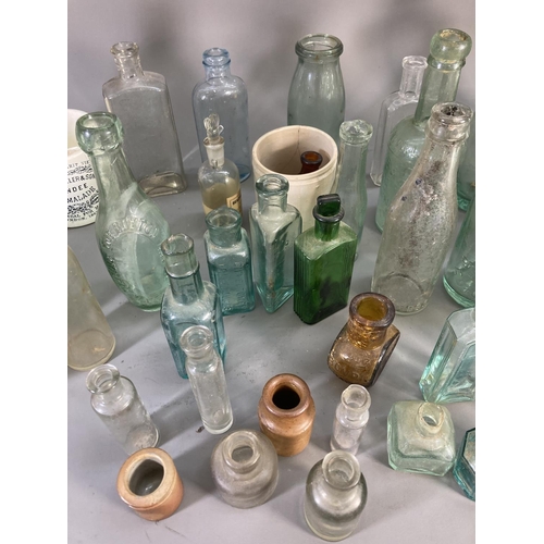 176 - A collection of vintage ceramics and glassware to include apothecary bottles, stoneware bottle, Jame... 