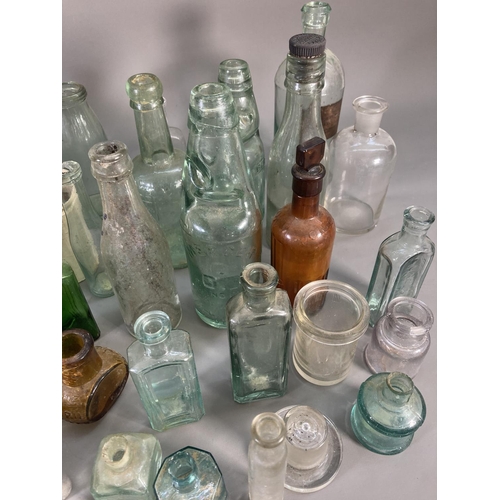 176 - A collection of vintage ceramics and glassware to include apothecary bottles, stoneware bottle, Jame... 