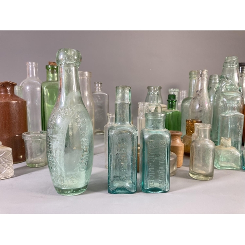 176 - A collection of vintage ceramics and glassware to include apothecary bottles, stoneware bottle, Jame... 