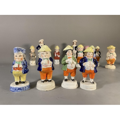 180 - Fifteen 19th century Staffordshire Pottery figures and character cruets