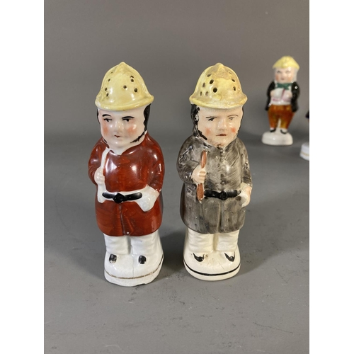 180 - Fifteen 19th century Staffordshire Pottery figures and character cruets