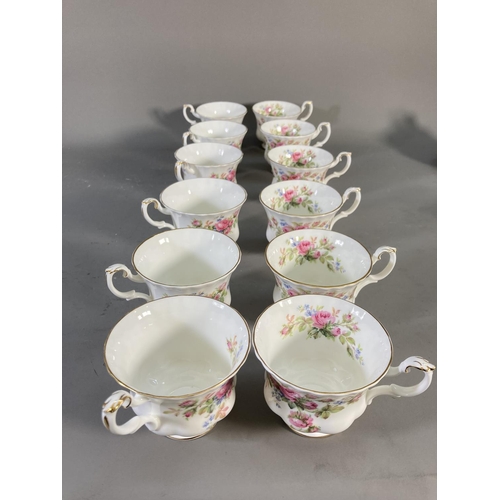 181 - A collection of Royal Albert Moss Rose china to include teapot, coffee pot, miniature teapot, twelve... 