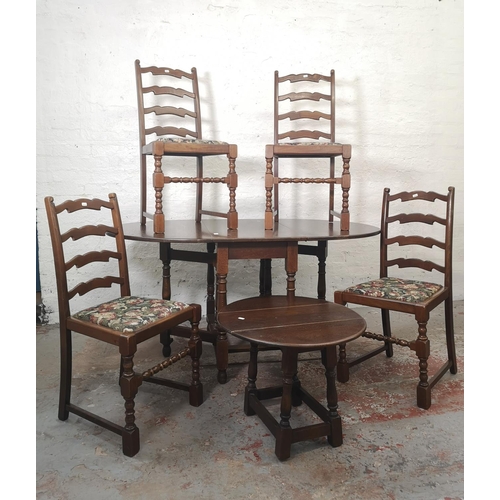 16 - A Jaycee oak drop leaf gate leg dining table with four matching chairs and one smaller matching drop... 