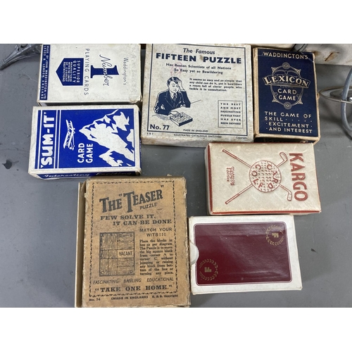 255 - A collection of vintage games to include Sum-it card game, the Teaser puzzle, Dominoes, Genuine Luma... 