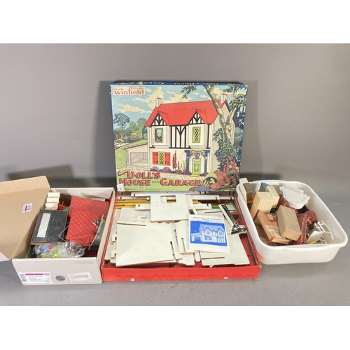 256 - A boxed vintage Winfield Packaway doll's house with garage with further doll's house accessories