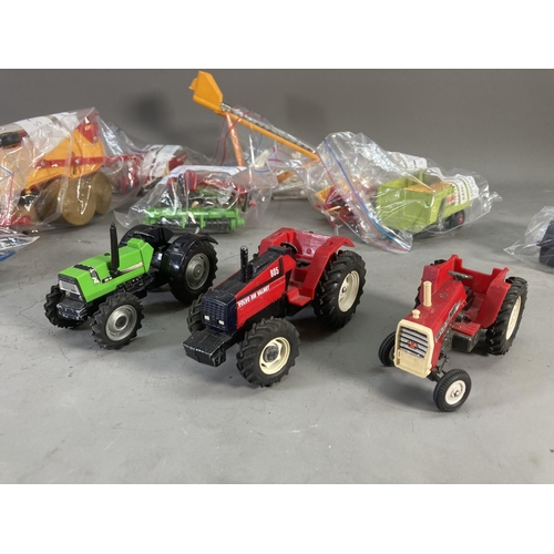 260 - A collection of 1980s Britain's model farm vehicles to include Massey Ferguson tractor, Volvo BM Val... 