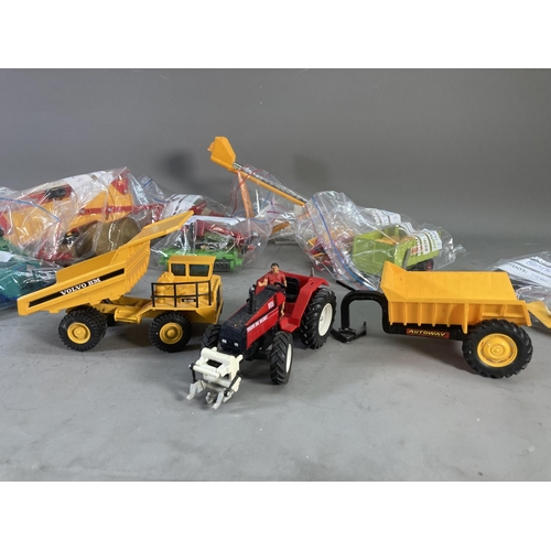 260 - A collection of 1980s Britain's model farm vehicles to include Massey Ferguson tractor, Volvo BM Val... 