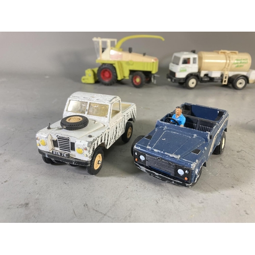 260A - A collection of 1980s Britain's model farm vehicles to include John Deere tractor, Landrover Defende... 