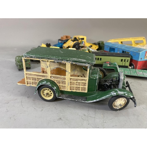 260D - A collection of assorted vintage diecast model vehicles to include Dinky tank transporter, Matchbox ... 