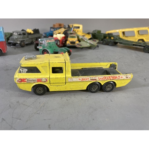 260D - A collection of assorted vintage diecast model vehicles to include Dinky tank transporter, Matchbox ... 