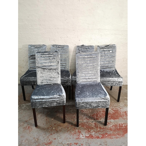 75 - A set of six modern cream leatherette dining chairs with silver crushed velvet chair covers