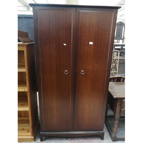 82 - A Stag Minstrel mahogany double wardrobe - approx. 178cm high x 95cm wide x 60cm deep