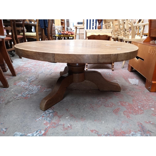 101 - A modern solid oak circular tripod pedestal coffee table - approx. 45cm high x 99 diameter