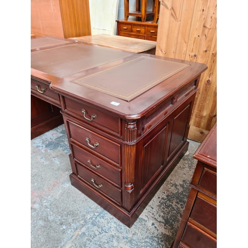 103 - A 19th century style mahogany partners desk with eleven drawers, two cupboard doors and brown leathe... 