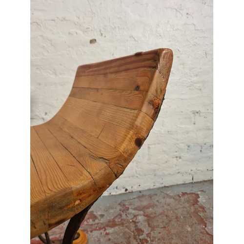 107 - A modern solid pine and wrought iron Savonarola type stool - approx. 67cm high x 52cm wide x 42cm de... 