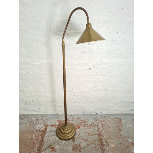 22 - A 1930s style brass floor lamp with adjustable gooseneck - approx. 177cm high when extended