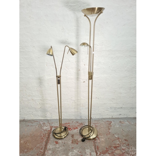 44 - Two modern brushed brass effect floor lamps - largest approx. 185cm high