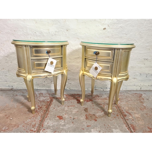 48 - A pair of Frank Hudson Ltd gilt wood bedside chests of two drawers with glass tops - approx. 66cm hi... 