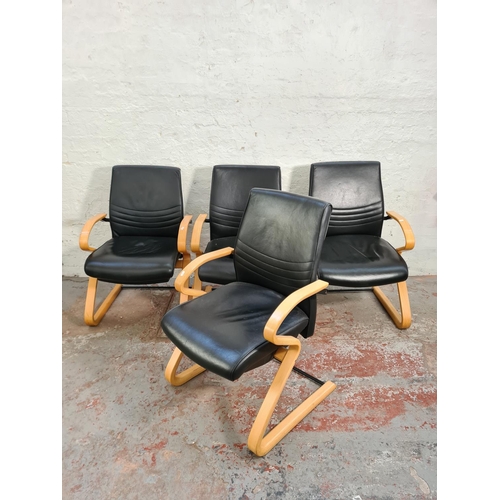 62 - A set of four modern black leatherette and bent beech wood armchairs