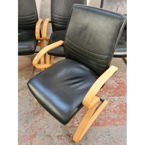 62 - A set of four modern black leatherette and bent beech wood armchairs