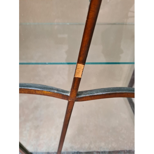 81 - A mid 20th century walnut display cabinet with single glazed door, two internal glass shelves, ball ... 
