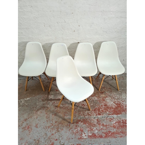 83 - A set of five modern Eames style white plastic and beech dining chairs