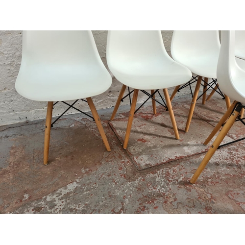 83 - A set of five modern Eames style white plastic and beech dining chairs