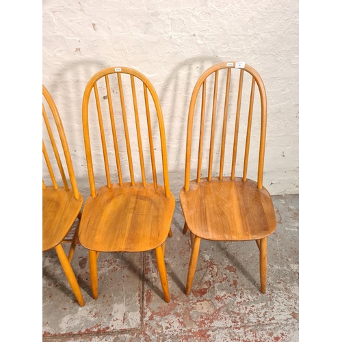 85 - A set of four Ercol style blonde elm and beech dining chairs