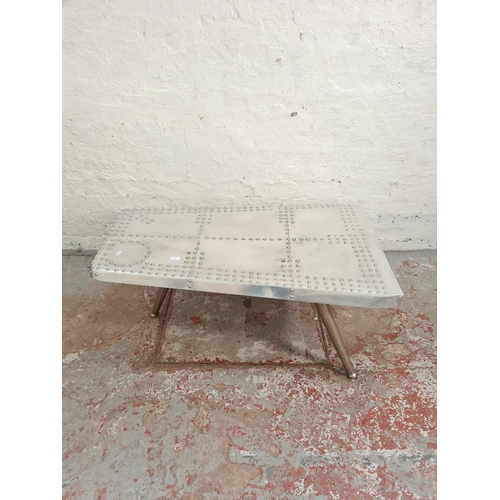 99 - An Aviator style aluminium tri-footed coffee table - approx. 43cm high x 70cm wide x 112cm long