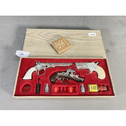 248 - A boxed BCM Outlaw Miniature Antique Firearms cap gun set