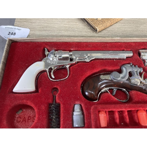 248 - A boxed BCM Outlaw Miniature Antique Firearms cap gun set