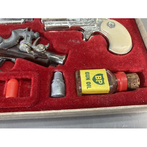 248 - A boxed BCM Outlaw Miniature Antique Firearms cap gun set