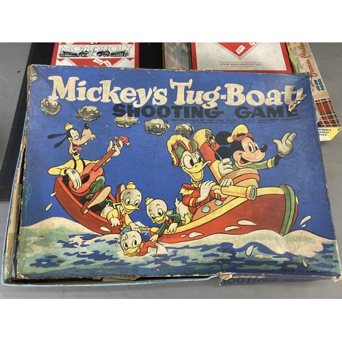 253 - A collection of vintage toys and games to include marbles, Shoot Match set, Monopoly, Mickey's Tug-B... 