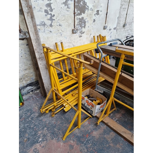 674A - A metal quick form scaffold tower set comprising feet, two tubs of scaffolding clips, scaffold board... 