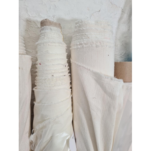 122A - Eleven rolls of neutral coloured fabric of varying lengths to include 9m x 3.2m sheer white voile, 2... 