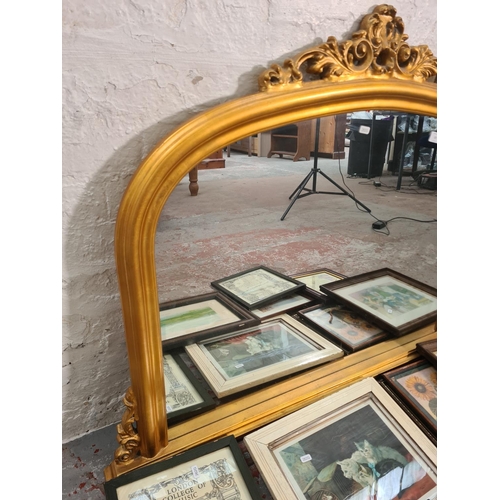 125 - A 19th century style gilt framed overmantel mirror - approx. 90cm high x 115cm wide and eight variou... 