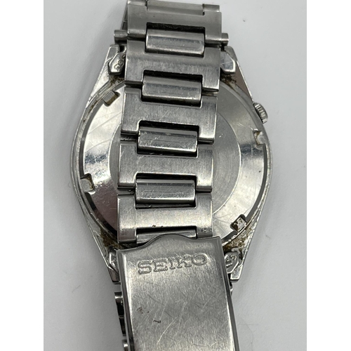 1386 - A Seiko automatic day date 35mm men's wristwatch - ref. 6309-7150