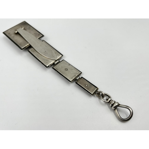 1336 - A white metal and wood watch chain stamped B & F