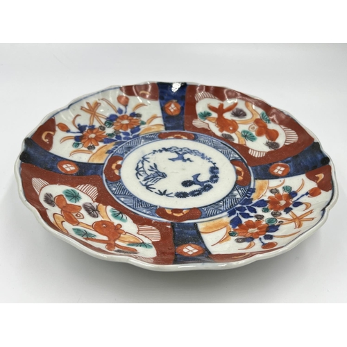 1329 - Two 19th century oriental porcelain plates, blue and white approx. 22cm diameter and one Imari appro... 