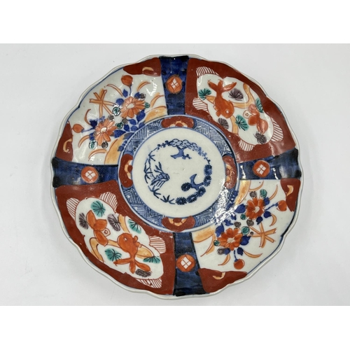 1329 - Two 19th century oriental porcelain plates, blue and white approx. 22cm diameter and one Imari appro... 