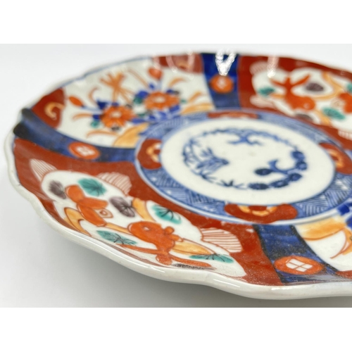 1329 - Two 19th century oriental porcelain plates, blue and white approx. 22cm diameter and one Imari appro... 