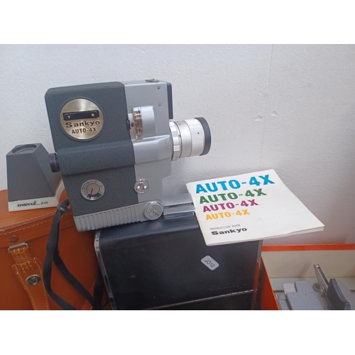 446 - A collection of items to include boxed Eumig P8 Phonomatic 8mm film projector, cased Sankyo Auto-4X ... 