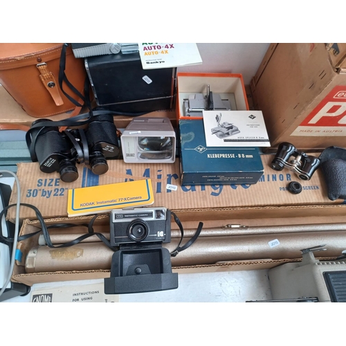 446 - A collection of items to include boxed Eumig P8 Phonomatic 8mm film projector, cased Sankyo Auto-4X ... 