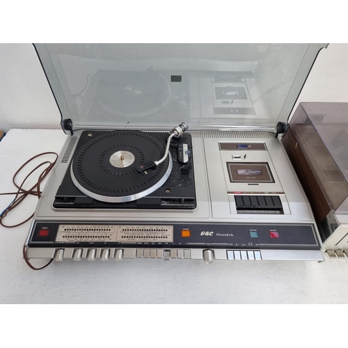 451 - Two vintage stereo music centres, one Sharp SG-220E comprising two speed turntable, cassette deck an... 